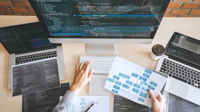 Developer building a responsive business website for a CloudWatch Solutions client